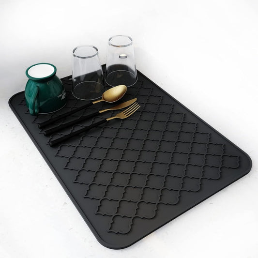 Black silicone dish drying mat on kitchen counter